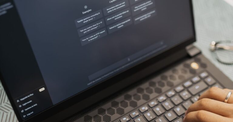 Developer working on a laptop with code on the screen, reviewing how an AI system behaves