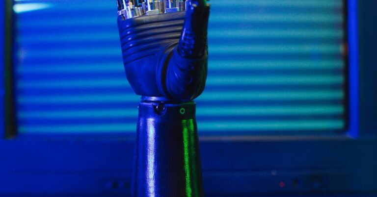 Blue robotic hand with LED lights, illustrating the AI systems companies build and use